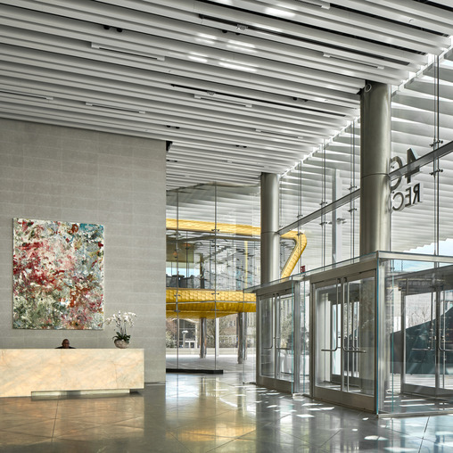 A large room with glass walls and a large glass door.