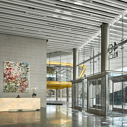 A large room with glass walls and a large glass door.