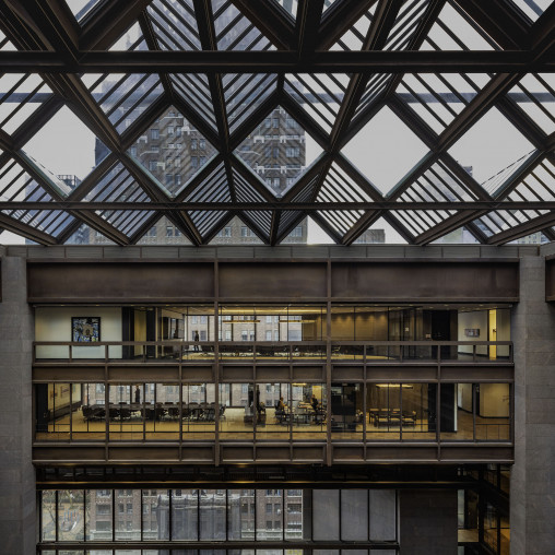 A large glass ceiling with a large glass window.