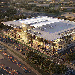 A large stadium with a parking lot.