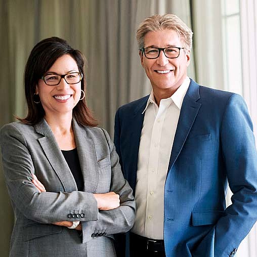 A man and a woman smiling.