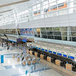 A large building with a few planes.