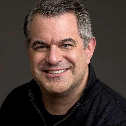 A man smiling for the camera.