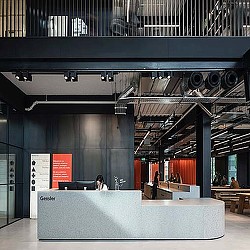 A room with a large table and people in it.