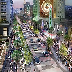 A busy street with cars and people.