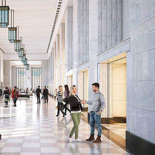 A group of people standing in a hallway.