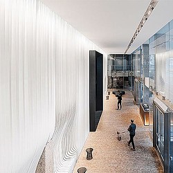 People walking in a hallway.