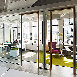 A person sitting at a desk in an office.