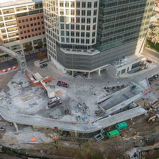 A construction site with cranes and buildings.