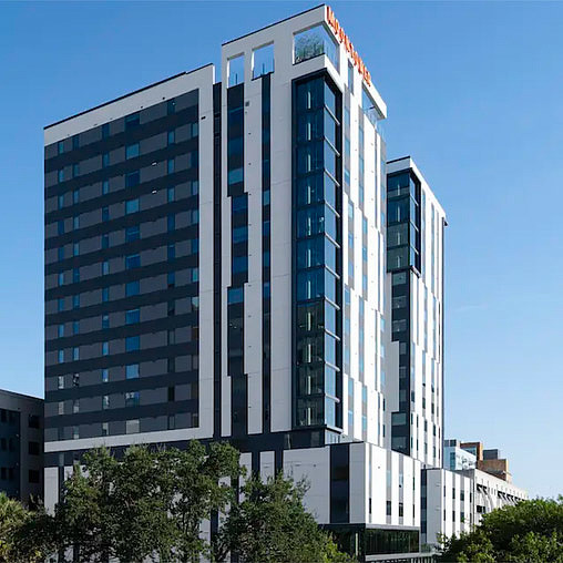 A tall building with many windows.