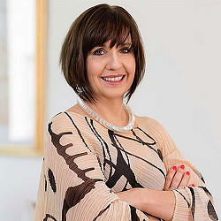 A woman with her arms crossed.