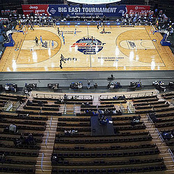 A hockey arena with people in it.