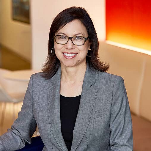 A woman wearing glasses.