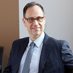 A man wearing a suit and tie.