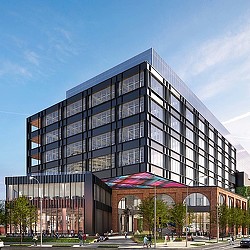 A large building with a parking lot.