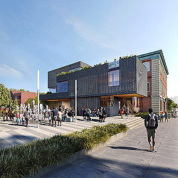 A group of people walking outside of a building.