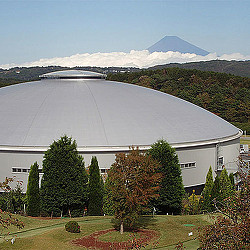 A building with a mountain in the background.