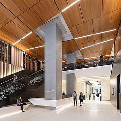 A group of people walking inside a building.