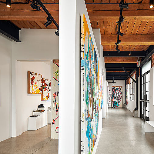 A hallway with art on the walls.