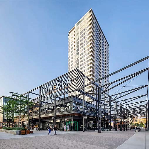 A tall building with a glass front.