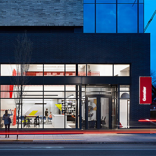 A building with a few people walking out front.