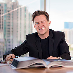 A man sitting at a desk.