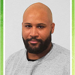 A bald man with a beard.