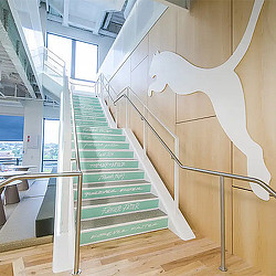 PUMA headquarters staircase with logo.