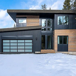A house with a snow covered yard.