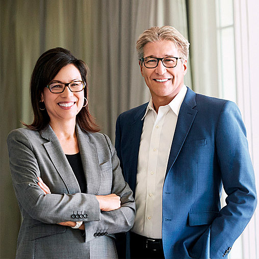 A man and a woman smiling.