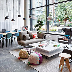 A living room with a couch and chairs.