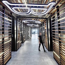 A person walking through a hallway.