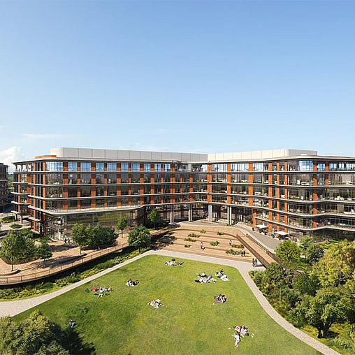 A large building with a lawn in front of it.