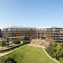 A large building with a lawn in front of it.