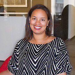 A woman smiling at the camera.