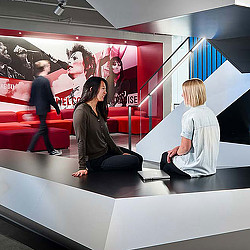 A person sitting on a stage.