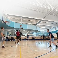 A group of people playing basketball.
