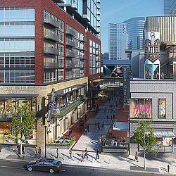 A street with buildings and cars.