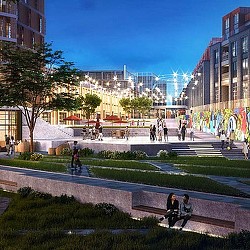A group of people walking around a park with buildings in the background.