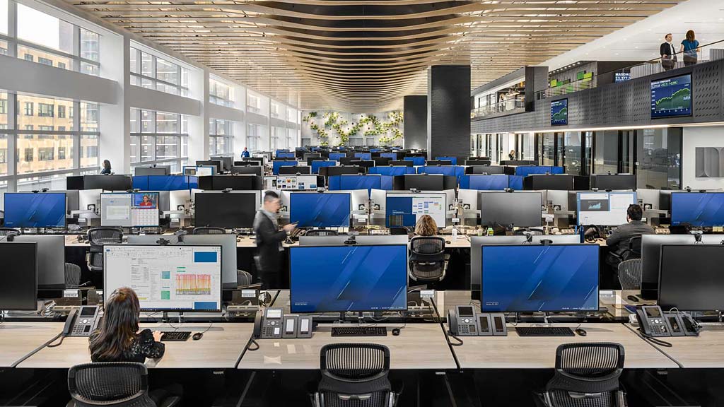 A group of people in a room with computers.