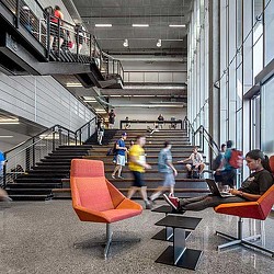 People playing basketball in a gym.