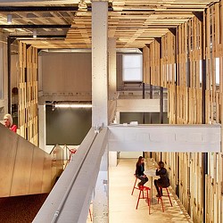 People sitting at tables in a room.