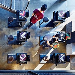 A person skating on a ramp.