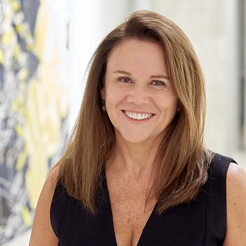 A woman smiling at the camera.
