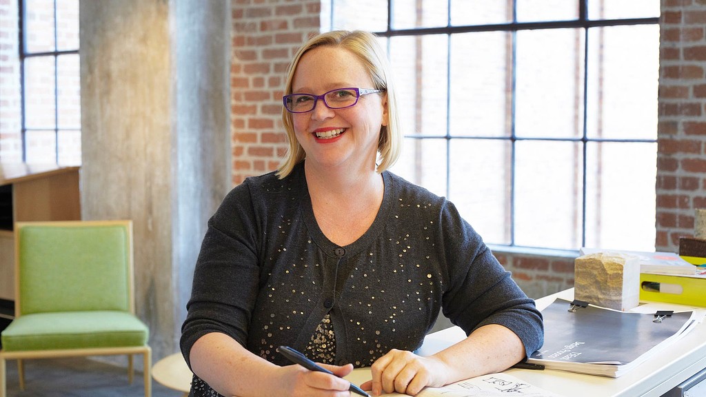 A woman sitting at a table.