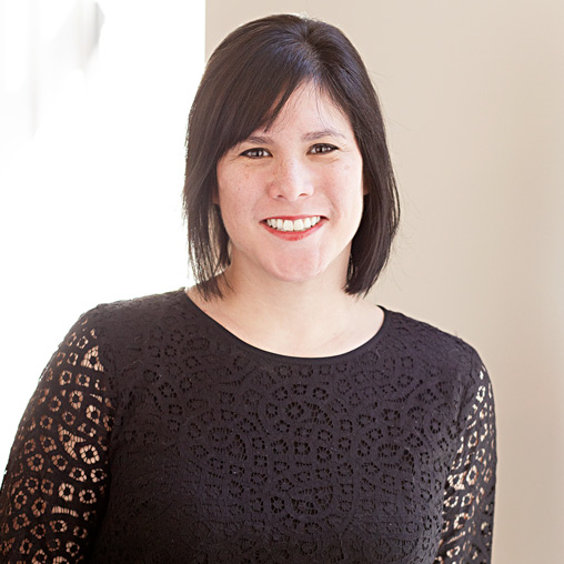 A woman smiling for the camera.