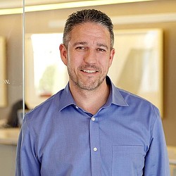 A man wearing a blue shirt.