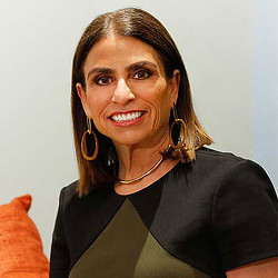 A woman smiling for the camera.