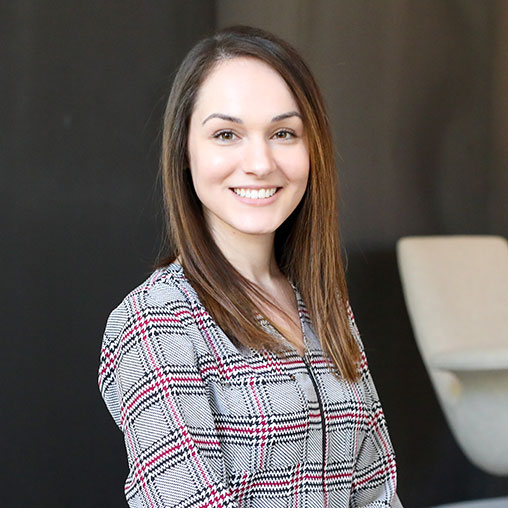A woman smiling for the camera.