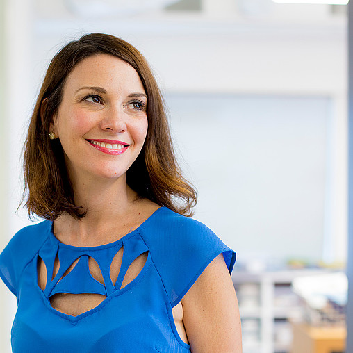 A woman in a blue shirt.